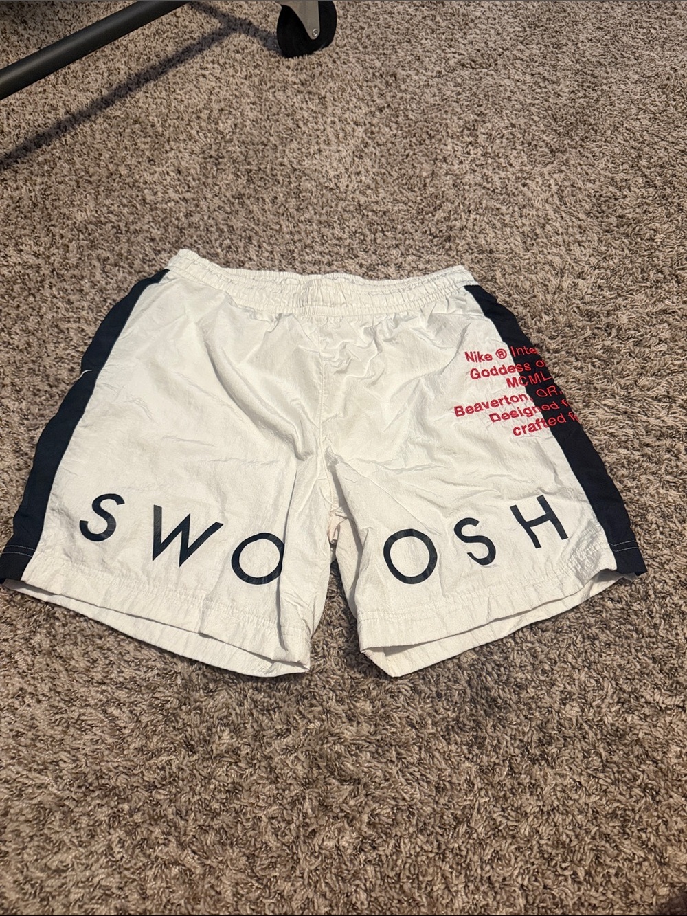 Nike White Athletic Shorts with black Side Panels and Red Logo